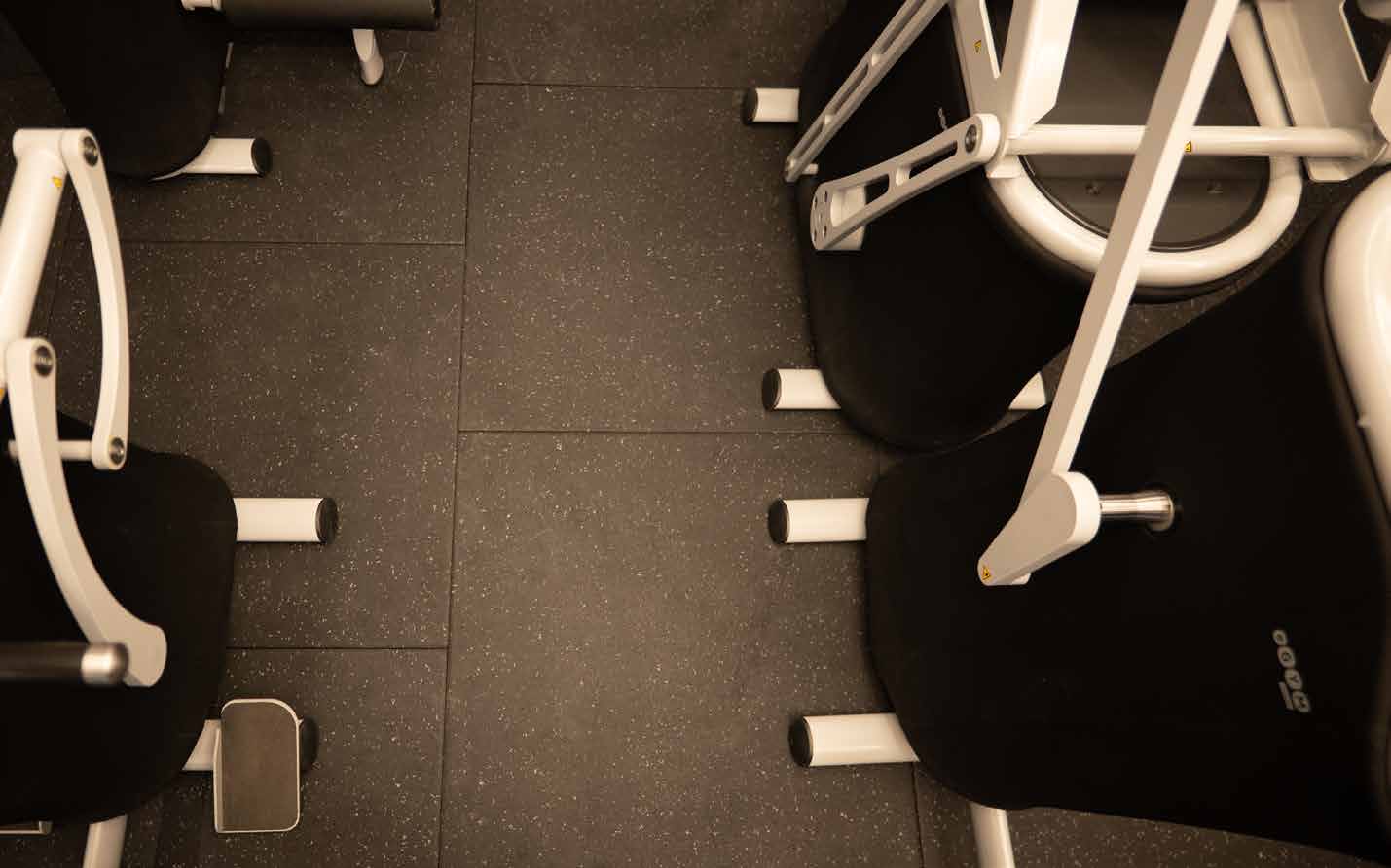Pavigym Connect flooring with integrated connection points beneath cardio equipment
